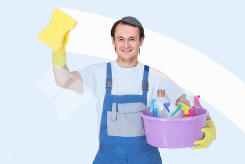 Team member handling carpet cleaning equipment safely