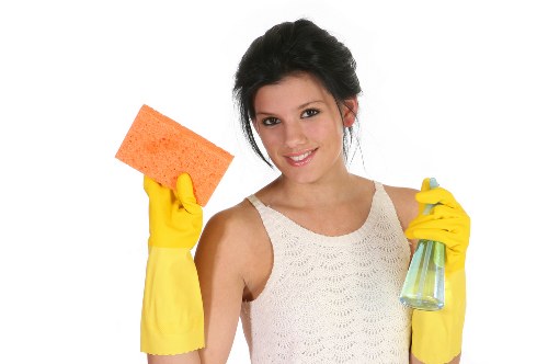 Technician removing stains from a sofa in Vauxhall